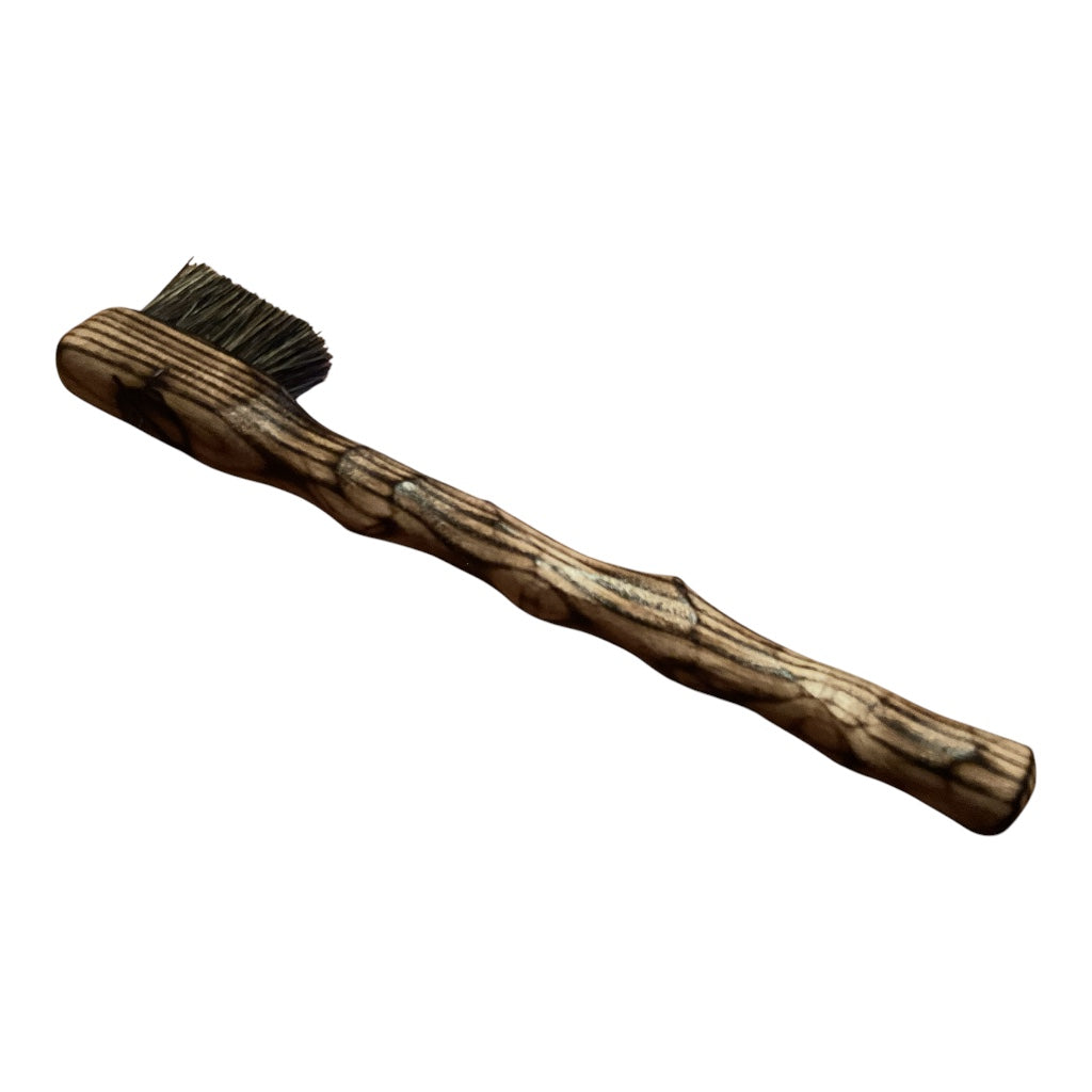 lightly scorched ash. small brush