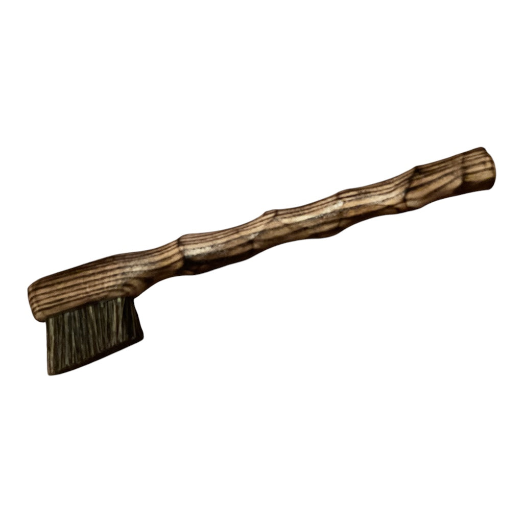 lightly scorched ash. small brush