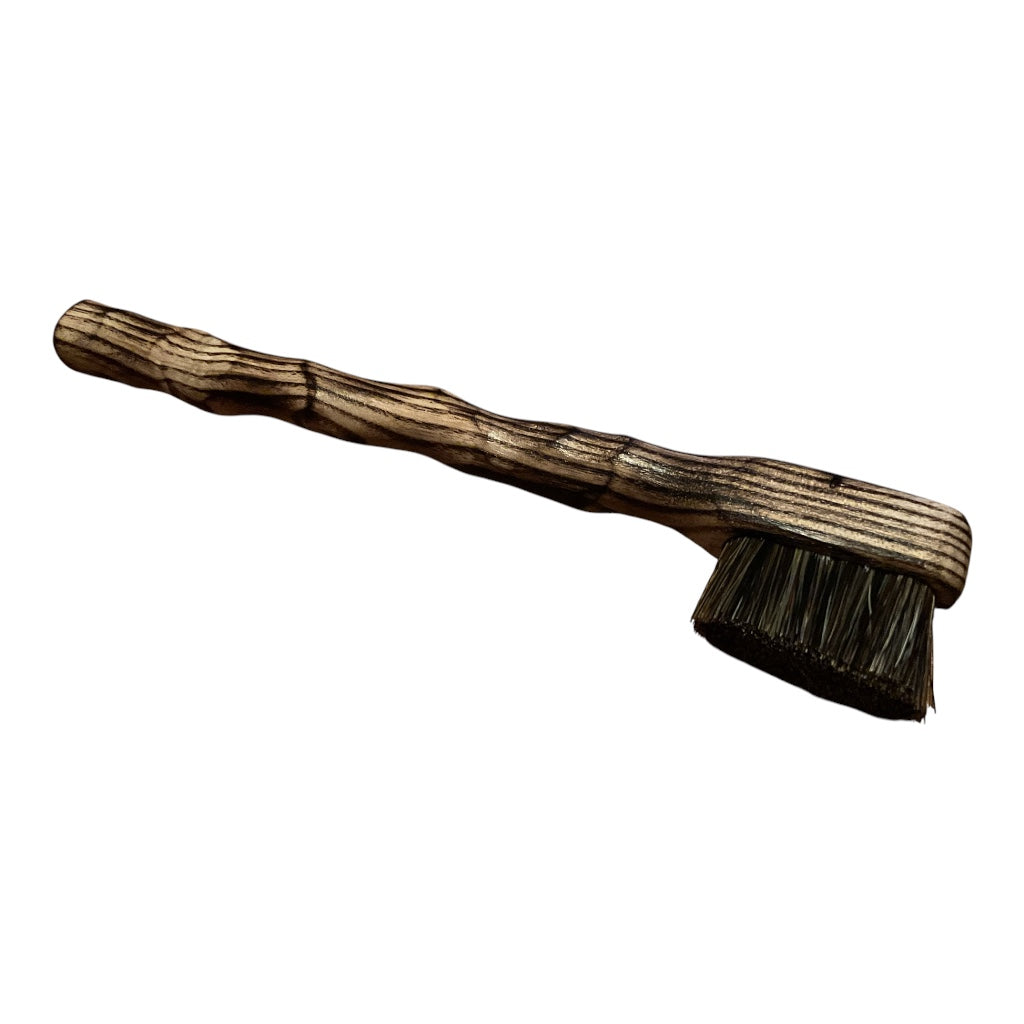 lightly scorched ash. small brush